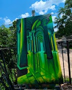 Tall abstract painting in layered greens and gold with arch-like forms
