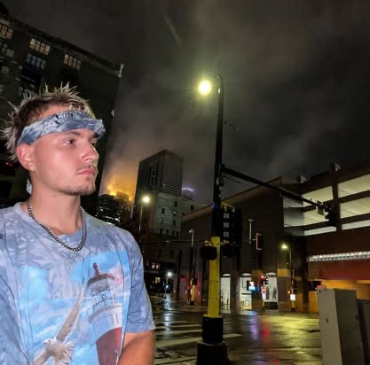Portrait of Jeffrey L'Esperance in a downtown setting at night